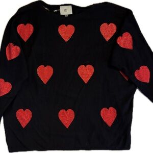 Black Sweater with Red Heart Accents